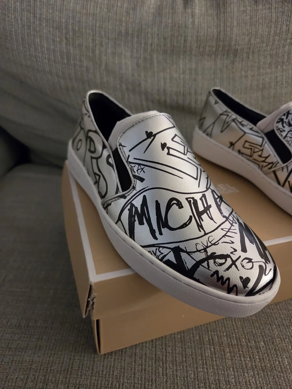 Michael Kors White Slip-On Sneakers with Black Graffiti